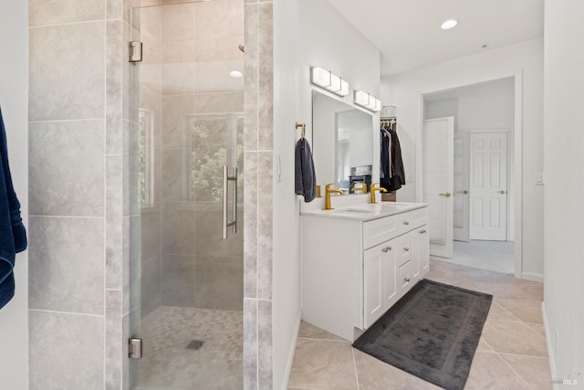 full bathroom featuring recessed lighting, a shower stall, tile patterned flooring, and vanity