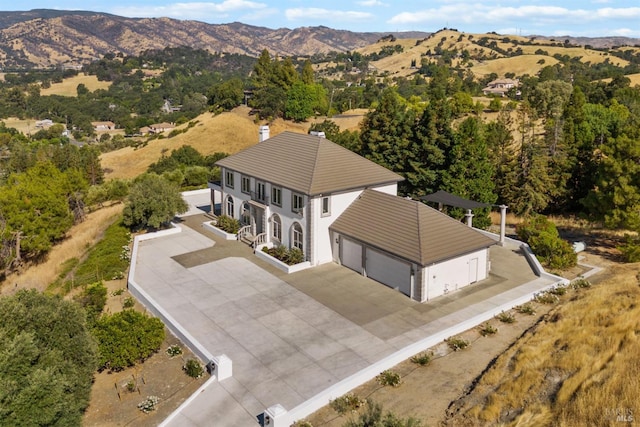 birds eye view of property featuring a mountain view