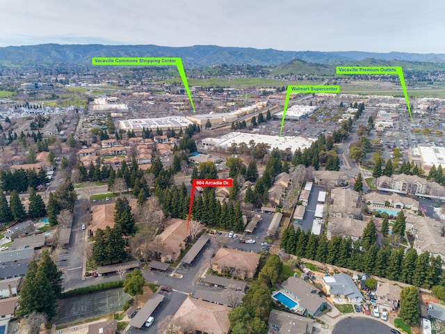 birds eye view of property featuring a mountain view