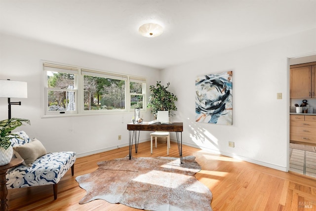 office featuring wood finished floors and baseboards