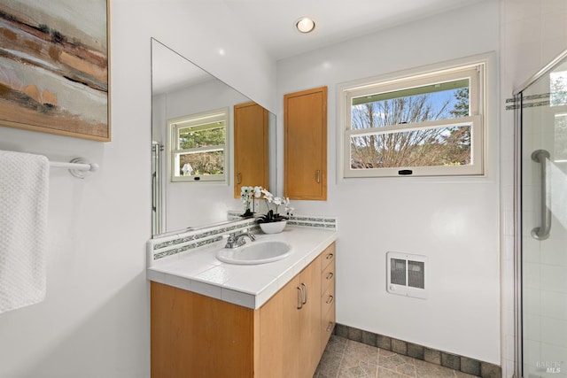 bathroom featuring recessed lighting, visible vents, vanity, tiled shower, and tile patterned floors