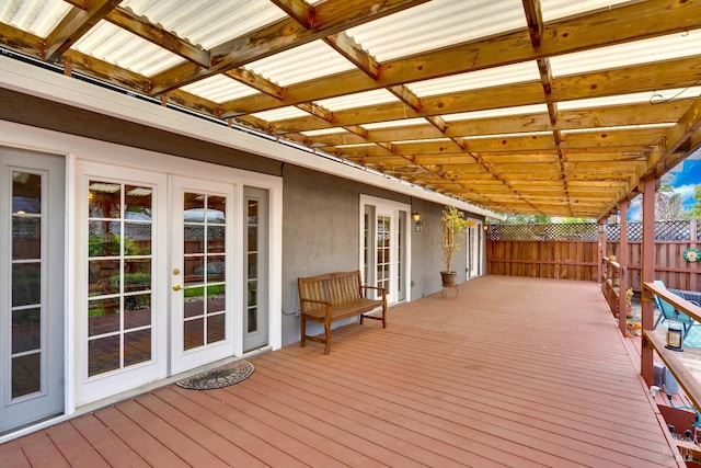 deck with french doors and fence