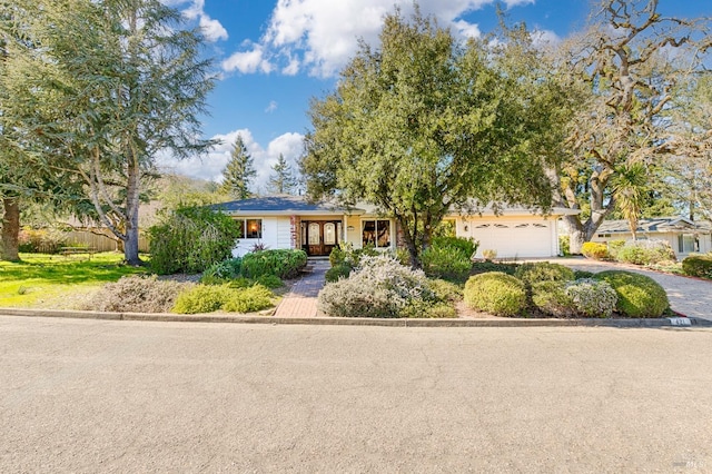 view of front of home with driveway and an attached garage