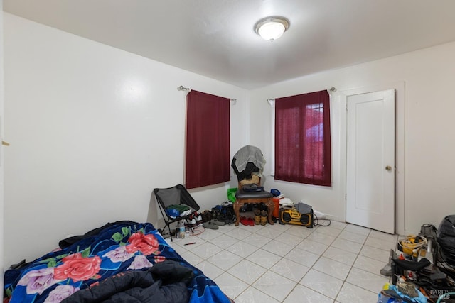 bedroom featuring light tile patterned floors