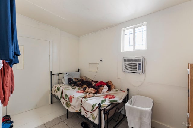 tiled bedroom with an AC wall unit and vaulted ceiling