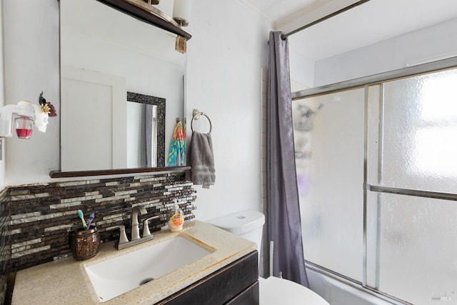 full bathroom with toilet, enclosed tub / shower combo, crown molding, vanity, and backsplash