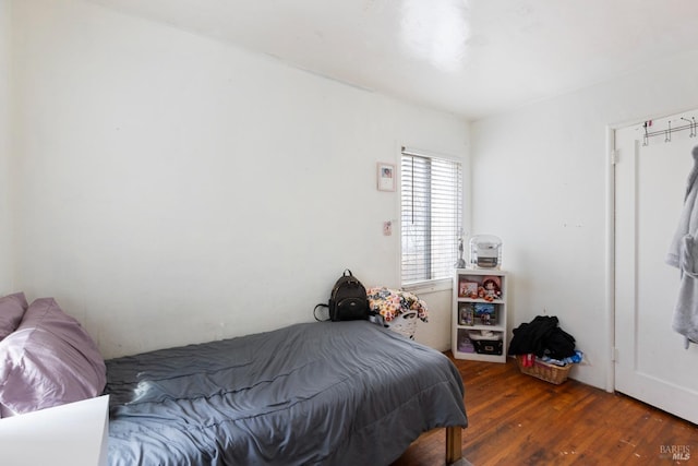 bedroom featuring wood finished floors