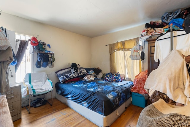 bedroom featuring wood finished floors