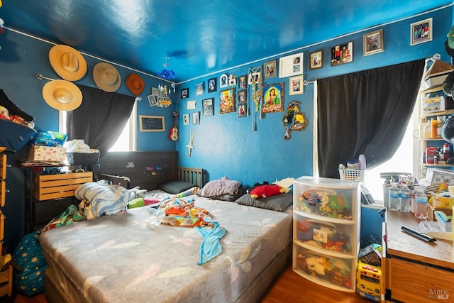 bedroom with wood finished floors