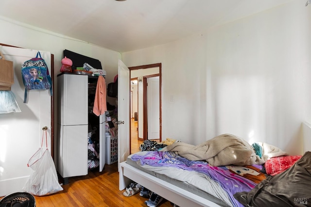 bedroom with wood finished floors