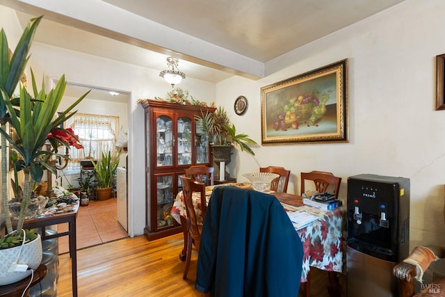 dining space featuring light wood-type flooring