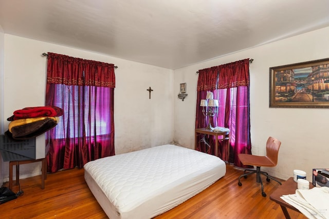 bedroom with wood finished floors