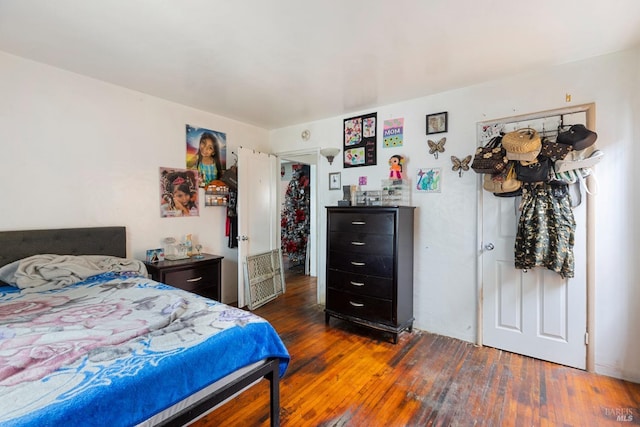 bedroom with hardwood / wood-style floors