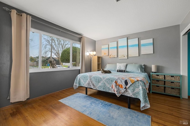 bedroom with wood finished floors