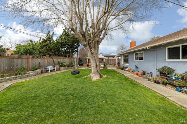 view of yard with a patio and a fenced backyard