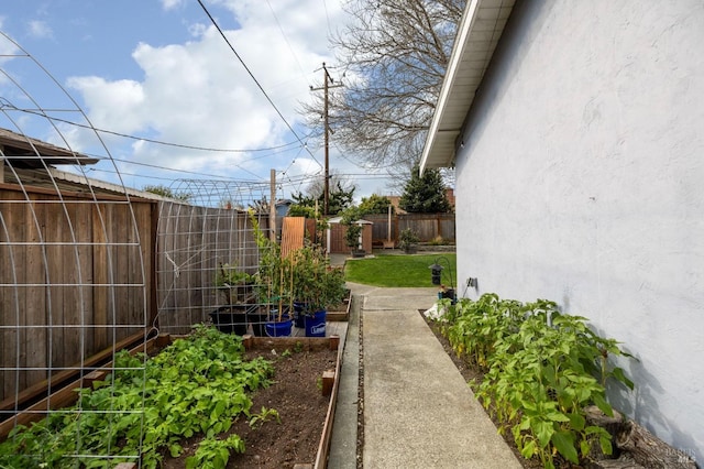 view of yard featuring a garden and fence