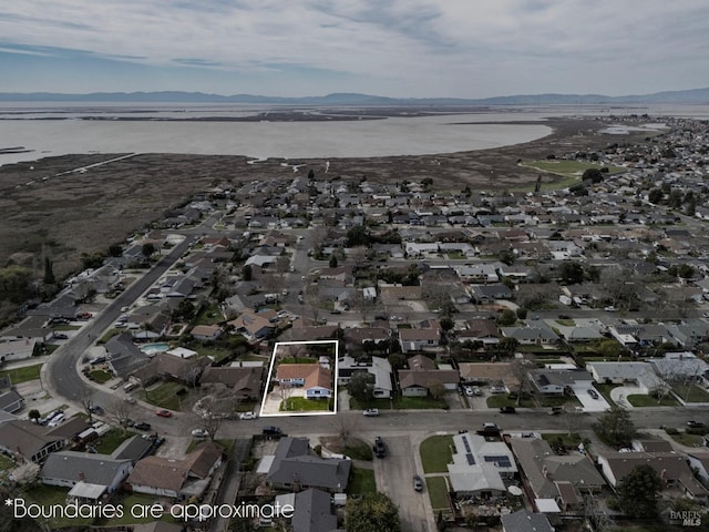 bird's eye view with a water view and a residential view