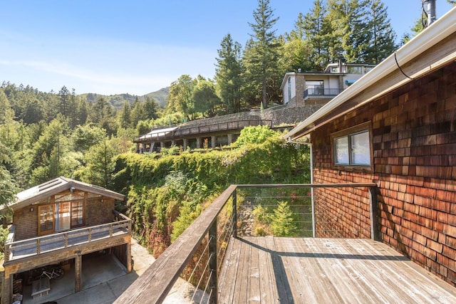 deck featuring a wooded view