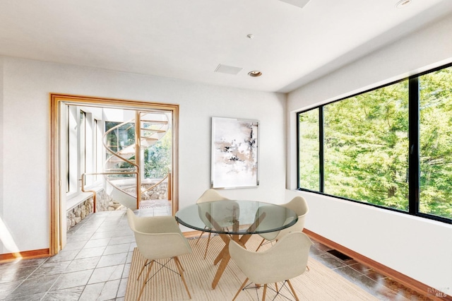 dining space featuring baseboards