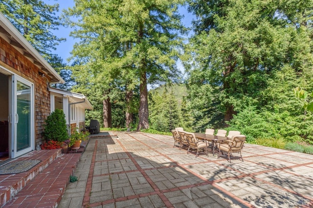 view of patio featuring outdoor dining area