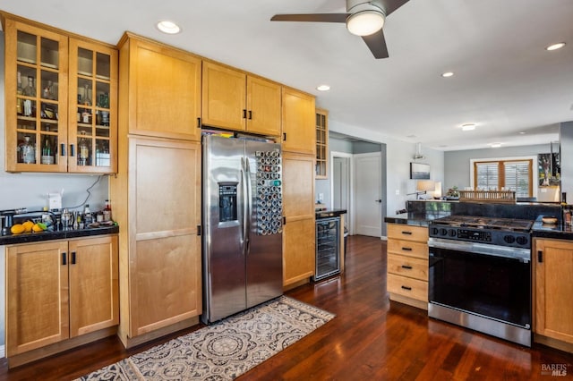 kitchen featuring dark countertops, stainless steel fridge with ice dispenser, wine cooler, dark wood finished floors, and gas range