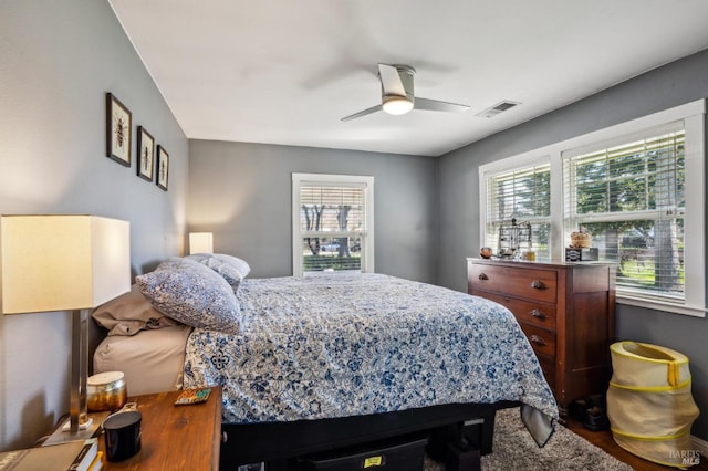 bedroom featuring a ceiling fan and visible vents