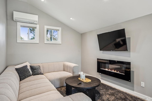 living area with lofted ceiling, a glass covered fireplace, a wall unit AC, recessed lighting, and baseboards