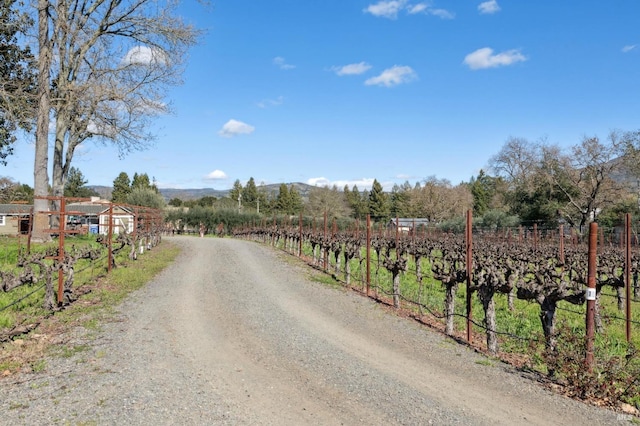 view of road featuring a rural view and a mountain view