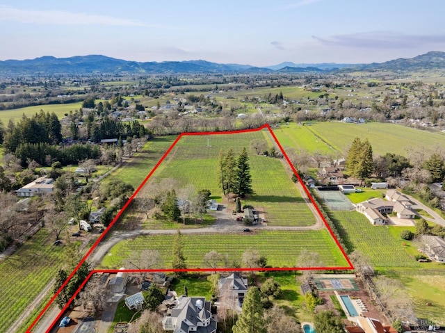 aerial view featuring a rural view and a mountain view