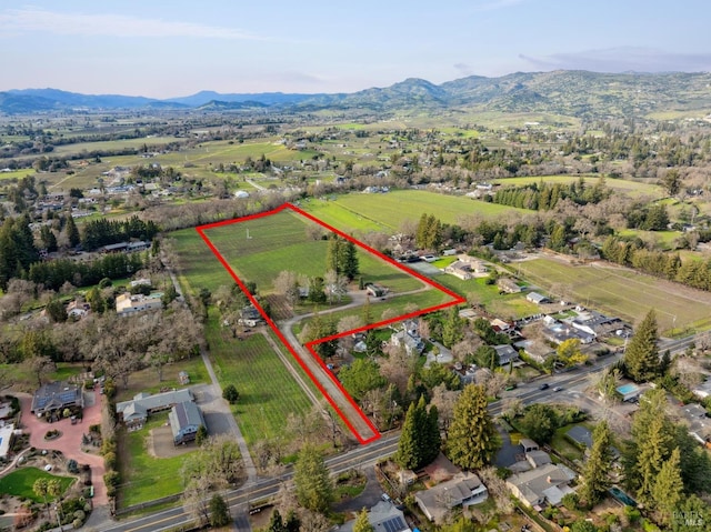 bird's eye view with a rural view and a mountain view