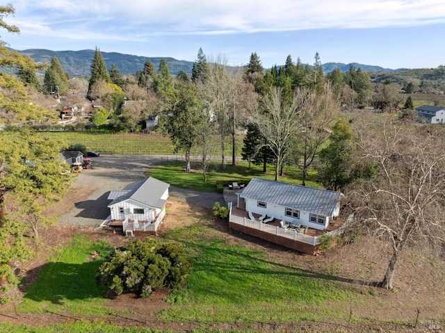 birds eye view of property featuring a mountain view