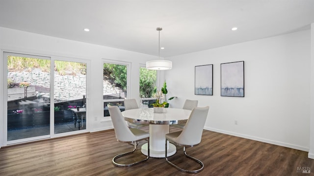 dining space with baseboards, dark wood-type flooring, a wealth of natural light, and recessed lighting