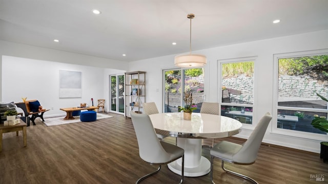 dining area featuring dark wood-style floors, recessed lighting, and a healthy amount of sunlight