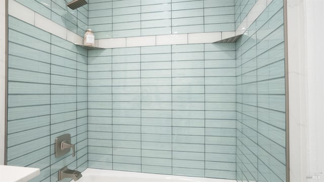 bathroom featuring a tile shower and a bath