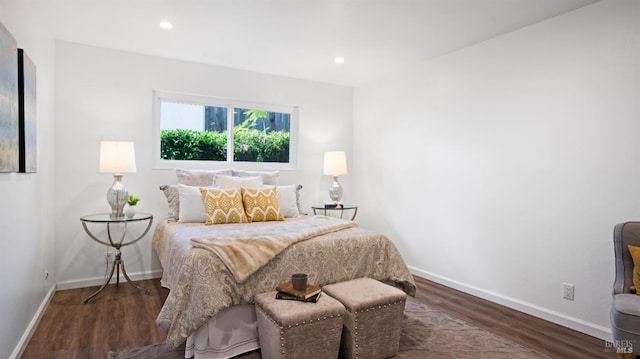 bedroom with recessed lighting, baseboards, and wood finished floors