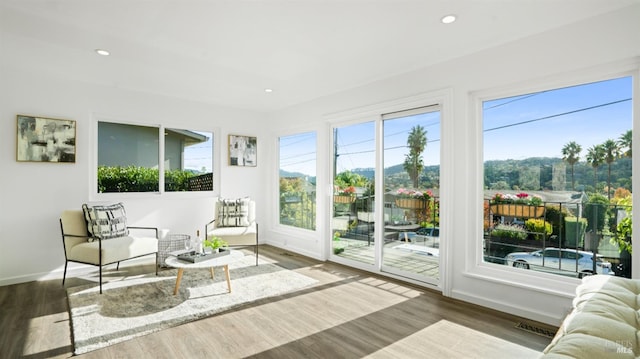 sunroom with plenty of natural light and visible vents