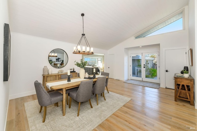 dining space featuring an inviting chandelier, a wealth of natural light, and light wood-style floors