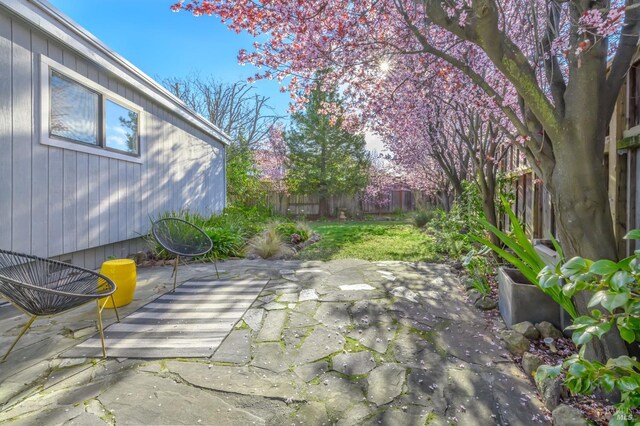 view of patio / terrace featuring fence