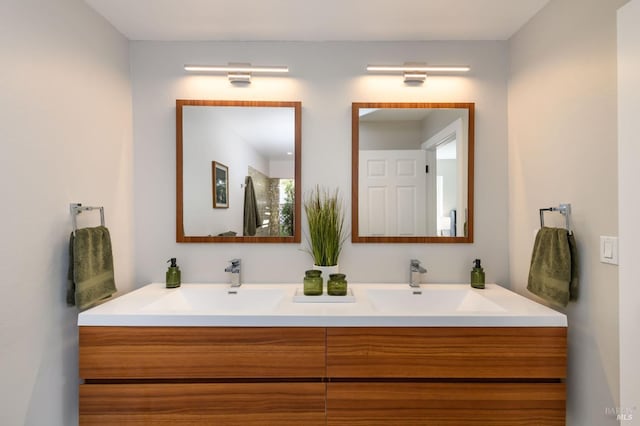 bathroom with a sink and double vanity