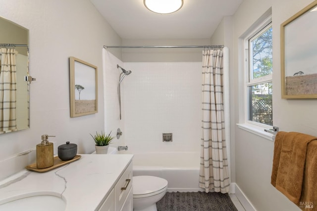 full bath featuring shower / tub combo, baseboards, vanity, and toilet