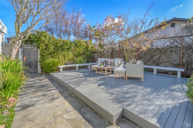 wooden deck featuring fence and an outdoor hangout area