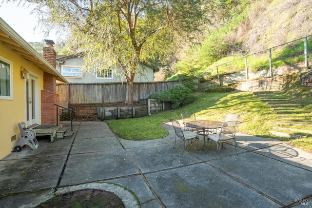 view of patio / terrace featuring outdoor dining space and a fenced backyard