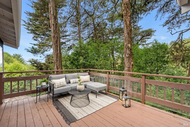 wooden terrace with an outdoor hangout area