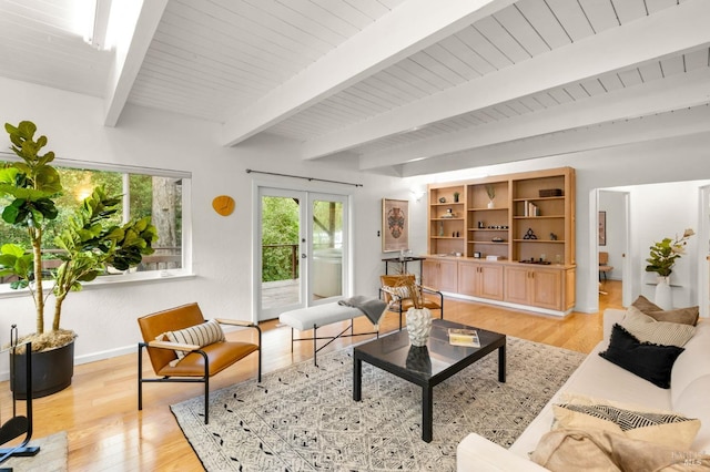 living room featuring wood ceiling, french doors, beamed ceiling, and light wood-style flooring