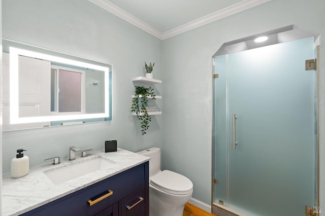 full bathroom featuring a stall shower, vanity, toilet, and crown molding