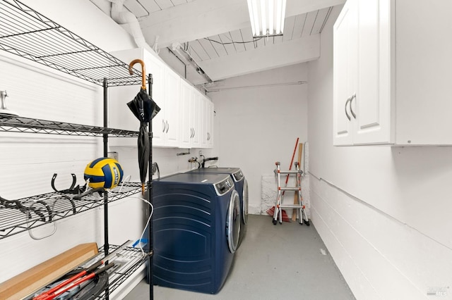 utilities featuring a garage and washer and clothes dryer