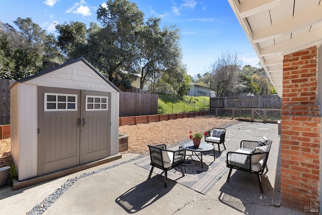 view of patio / terrace featuring a shed, an outdoor structure, and a fenced backyard