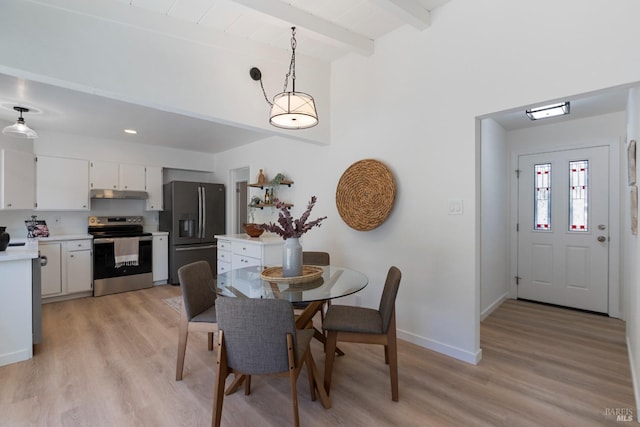 dining area with light wood-style floors, baseboards, and beamed ceiling