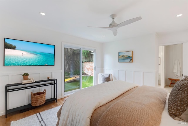 bedroom with a ceiling fan, wood finished floors, access to exterior, a decorative wall, and recessed lighting