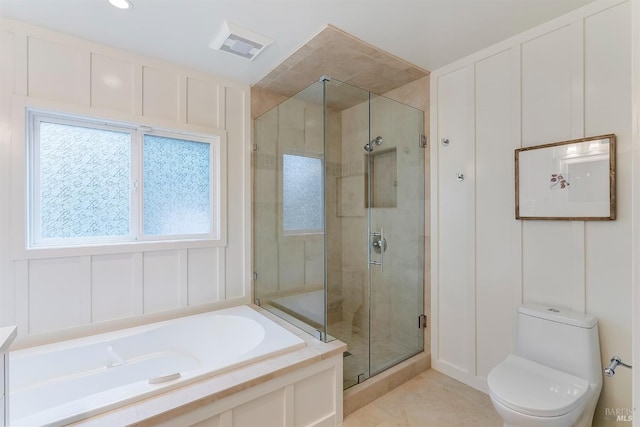 bathroom with toilet, a shower stall, visible vents, and a decorative wall